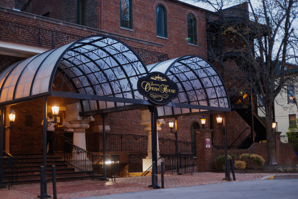 The side entrance to the Lexington Opera House with arched canopies.