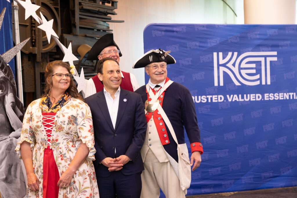 The Honorable Craig Greenberg, Louisville Mayor, posing with members of the National Society of the Sons of the American Revolution Color Guard at KET's Louisville event.