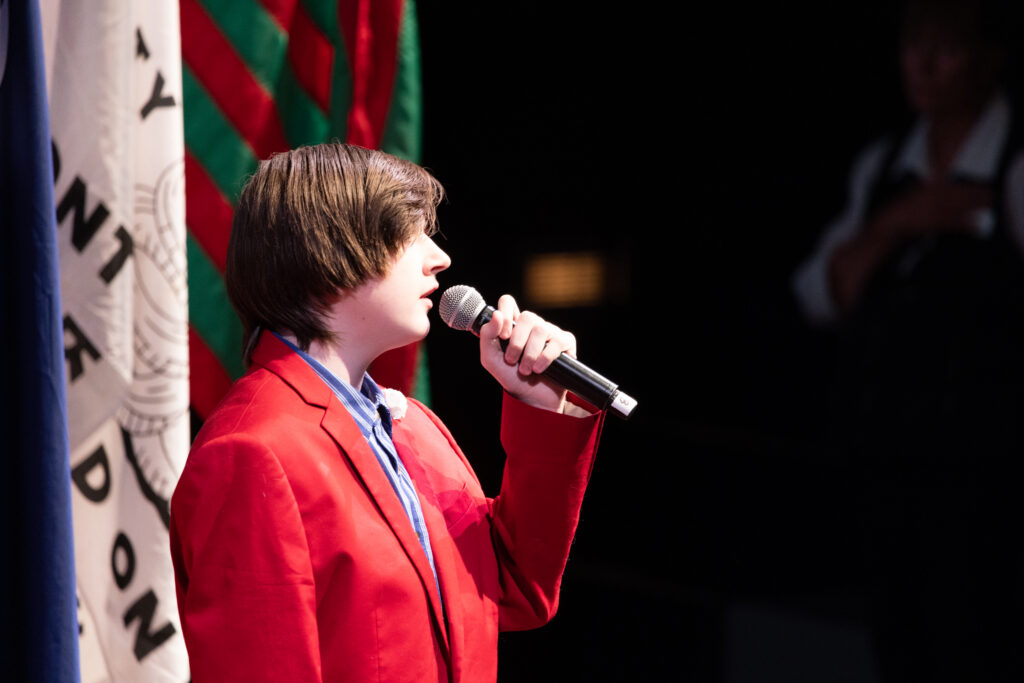 Everett Brunton of the Louisville Youth Choir singing the National Anthem at KET's Louisville event.