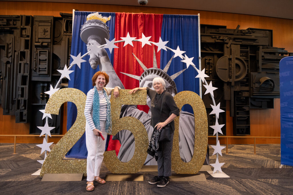 Guests posing with themed decor at KET's Louisville event.